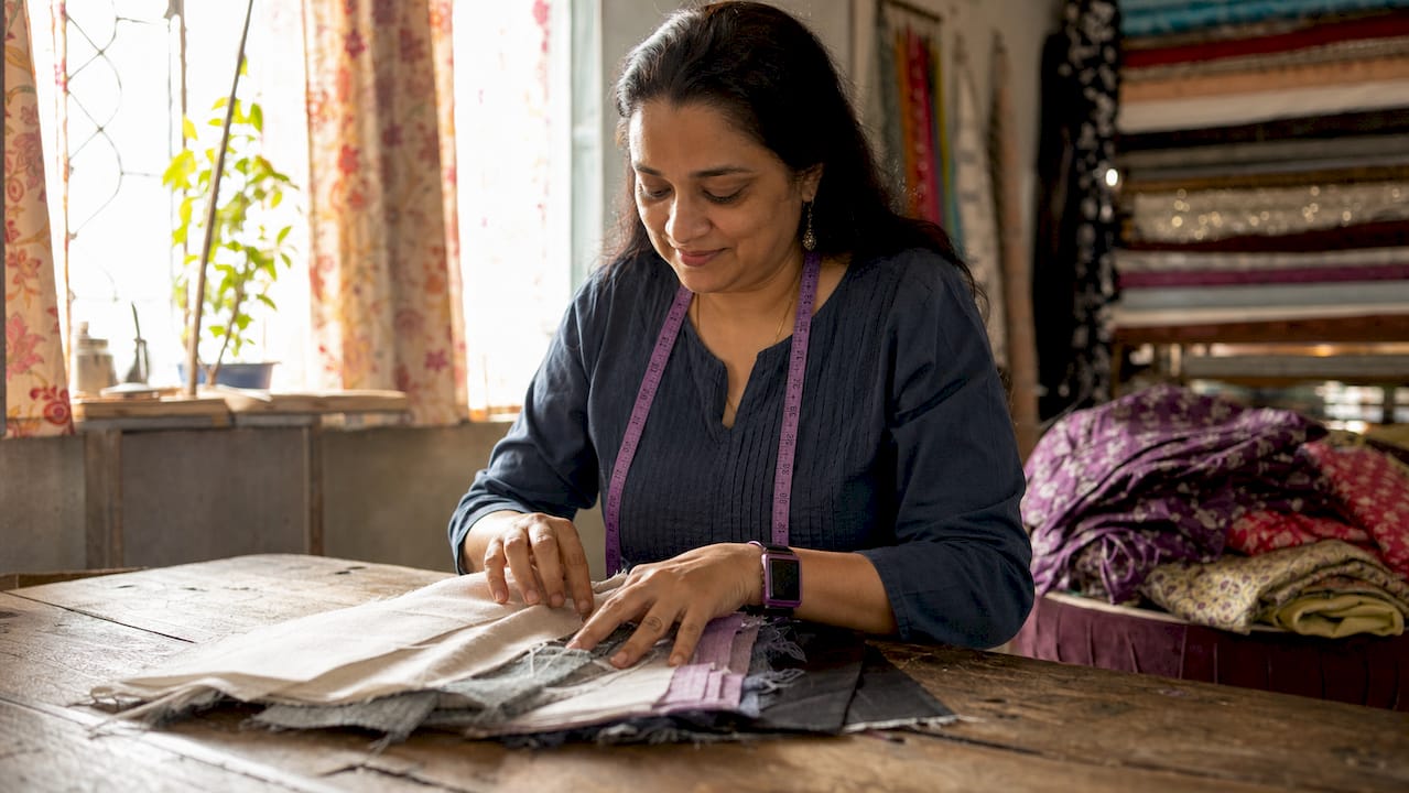 Woman comparing cotton and polyester fabrics